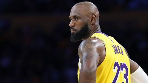 LA Lakers legend LeBron James looks on during a game
