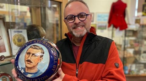 Tim Baker who has been painting Royal Shrovetide balls since 1991