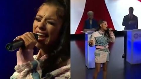 A composite image showing two photos of singer Loomis performing in front of debate candidates at an elections debate. She is holding a microphone and wearing a white, pink and blue matching set of a shirt and skirt.