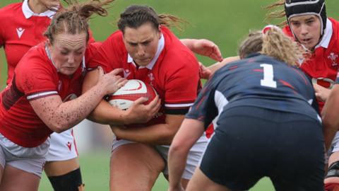 Abbie Fleming of Wales and Gwenllian Pyrs of Wales charge forward