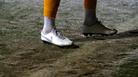 Generic view of a player stood on a frozen pitch