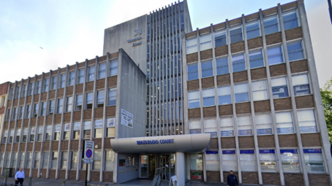 A six-storey office block of concrete and glass.