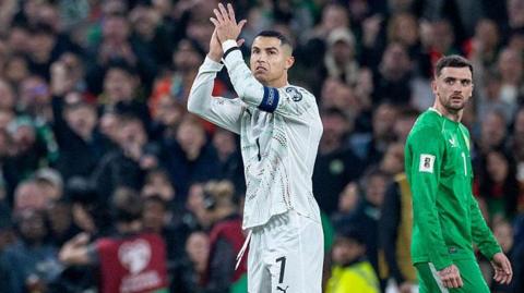 Cristiano Ronaldo of Portugal reacts to the crowd after receiving a red card against Republic of Ireland