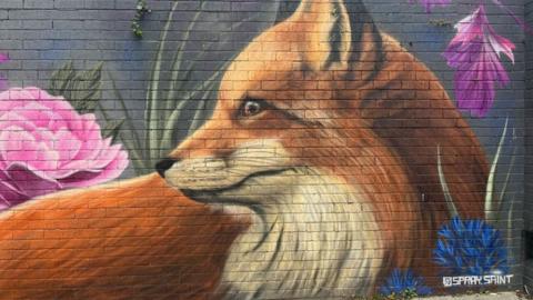 A spray painting of a fox