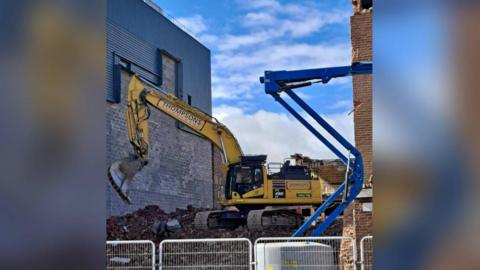 A digger on top of a pile of rubble at the site of the former Marks & Spencer and Goodwins stores on Redcar’s Esplanade