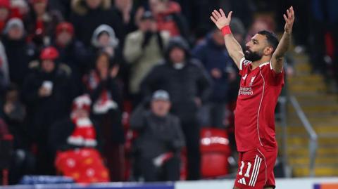 Mohamed Salah celebrates in front of the Anfield crowd