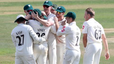 Worcestershire celebrate after the second of Brett D'Oliveira's two pieces of stunning fielding in three balls at Chelmsford