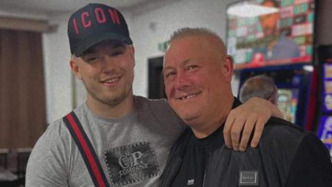 Kane Forder stands with his arm around his dad Dave. 