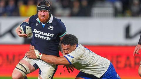 Gregor Brown carries the ball