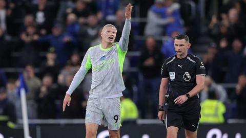 Erling Braut Haaland of Manchester City argues with Referee Michael Oliver