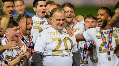 Marcelo Bielsa (centre) celebrates winning promotion to the Premier League in 2019-20