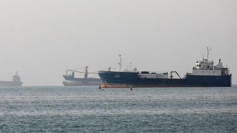 Boats seen in the Strait of Hormuz from the coast of Iran