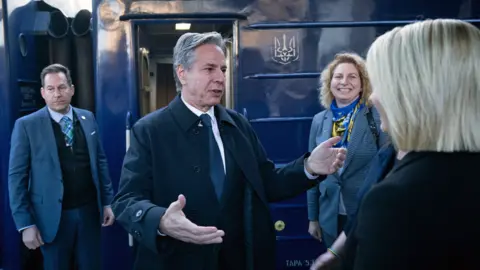 US Secretary of State Antony Blinken is greeted by US Ambassador to Ukraine Bridget A. Brink after arriving by train at Kyiv-Pasazhyrskyi station on 14 May 2024, in Kyiv, Ukraine