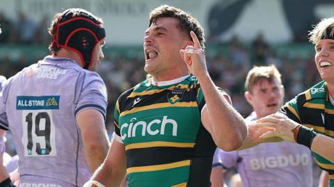 George Furbank holds up one finger after scoring the winning try for Northampton Saints against Gloucester