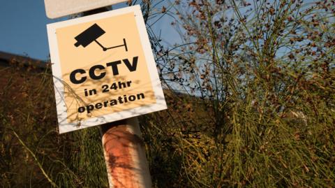 A sign that reads "CCTV in 24hr operation".