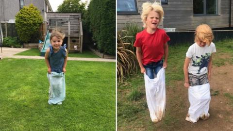 Pupils doing a sack race in a pillow case - Freya, Milo and Archie