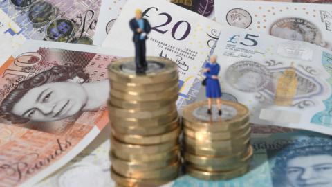 A photo of some pound coins and UK notes.