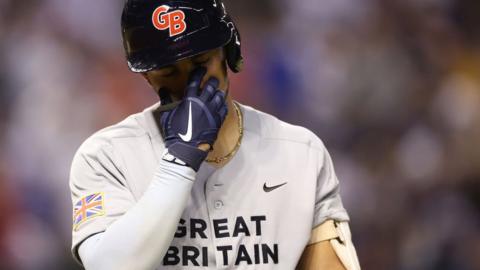 Harry Ford #1 of Team Great Britain reacts to a strike out against Team USA during the eighth inning of the World Baseball Classic Pool C game at Chase Field