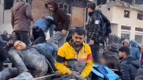 Screengrab of video posted online reportedly showing casualties on a lorry ear Nabulsi roundabout on Rashid Street, south-west of Gaza City (29 February 2024)