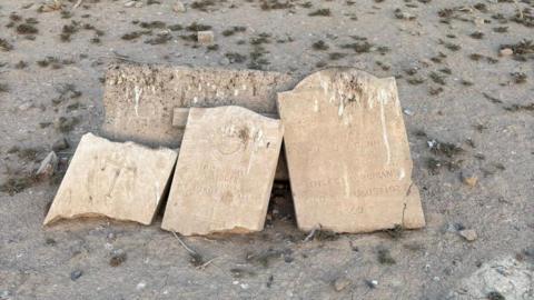 Damaged headstones in Iraq