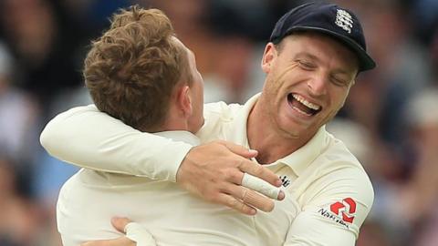 Jos Buttler celebrates with Dom Bess