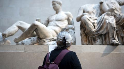 Visitors in the Parthenon Galleries in London's British Museum where visitors admire the Ancient Greek Parthenon Metopes also knows as the Parthenon Marbles aka Elgin Marbles, on 28th November 2023, in London, England