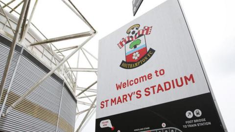 A general view of a sign showing Southampton's badge outside St Mary's Stadium