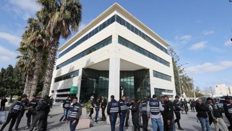 Security forces outside the headquarters of the Supreme Judicial Council