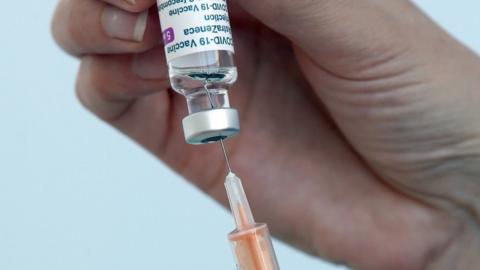 Covid-19 vaccine and syringe