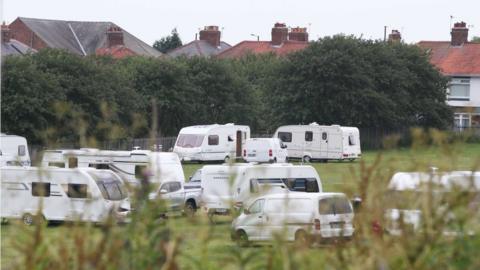 Traveller caravans parked on a field in Cowgate, Newcastle
