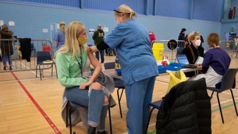 People receive their coronavirus vaccine