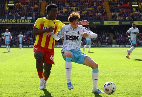 Footballer Nestory Irankunda competing for possession while playing for Watford Football Club against Charlton Athletic Football Club