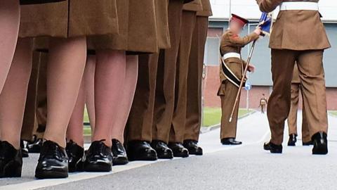 A stock image shows the feet of junior soldiers lining up with guns as they prepare to march ahead of their graduation parade at the Army Foundation College in 2015.