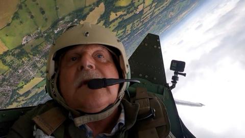 Man in Spitfire cockpit