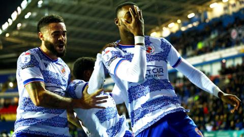 Kelvin Ehibhatiomhan celebrates by placing his hand across his face