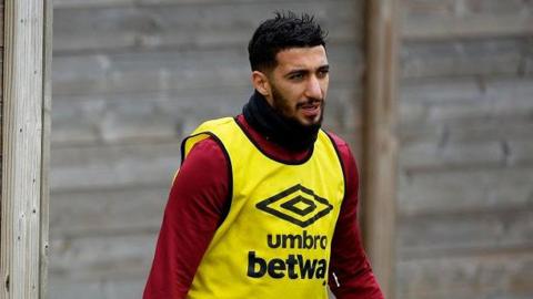 Said Benrahma training outside, wearing an Umbro bib