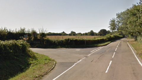 An A road in the countryside with a lane off to the left