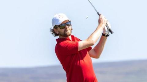 Daryl Callister swinging a golf club