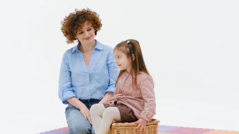 Mother talking to child.