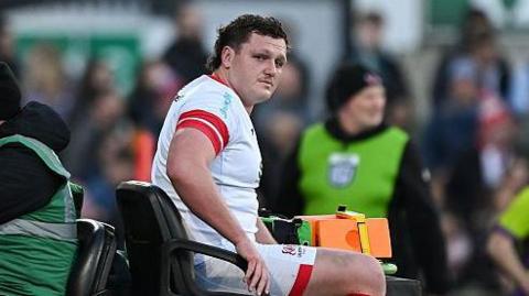 Angus Bell is taken off the pitch on a cart during Friday's defeat by Leinster 