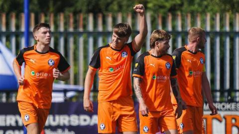 Josh Stevenson celebrates after scoring Airbus' winner at Haverfordwest