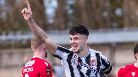 Harry Owen celebrates scoring for Flint Town United