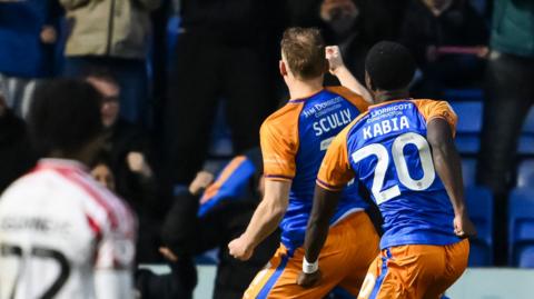 Shrewsbury attacker Anthony Scully celebrates his goal against Newport
