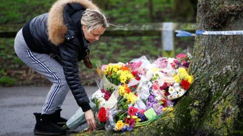 People lay floral tributes near to where 17-year-old Jodie Chesney was killed.