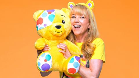 Sara Cox holding a Pudsey Bear