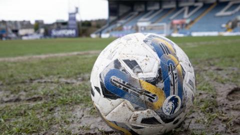 A ball on the waterlogged Dens Park pitch