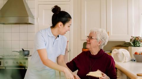 Elderly lady with home carer