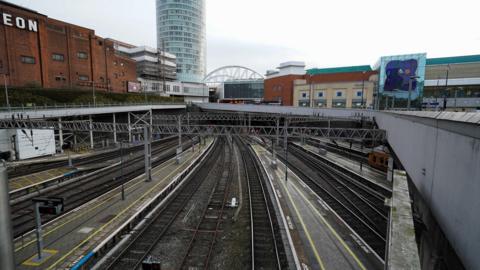 Photo taken from an elevated position of the railway lines leading out of Birmingham New Street. The Odeon can be seen on the left and the Birmingham rotunda is close to the centre of the shot. 