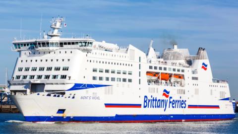 A white ferry with "Brittany Ferries" written on the side.