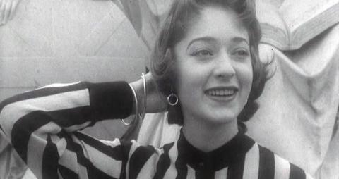 Lynette, a teenage fashion model, wears a striped top for the camera